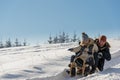 Young playful couple having fun in the snow