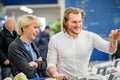 Ouple having fun while choosing fish in the supermarket. Royalty Free Stock Photo