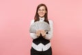 Young pleasant beautiful business woman in glasses holding bundle lots of dollars, cash money on pink