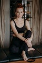 Young pleasant looking woman restinf after pilates training on trapeze table