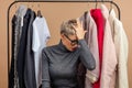 Young pleasant woman is fedding up shopping. close up shot