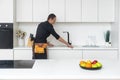 Young plumber repairing tap at kitchen Royalty Free Stock Photo