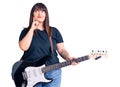 Young plus size woman playing electric guitar serious face thinking about question with hand on chin, thoughtful about confusing Royalty Free Stock Photo