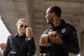 young police officers having coffee break