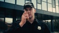 young policeman in uniform and cap