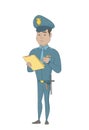 Young policeman in uniform writing on clipboard.