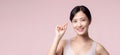 Portrait young asian woman happy smile face with vitamin nourishment pill. Pretty cute girl female person holding health capsule Royalty Free Stock Photo