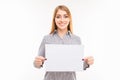 Young positive businesswoman showing blank sheet of paper Royalty Free Stock Photo