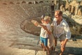 Young positive family take a self photo on the antique sights in Royalty Free Stock Photo