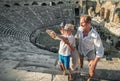 Young positive family take a self photo on the antique sights in Royalty Free Stock Photo