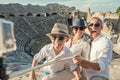 Young positive famly take a vacation photo on the Side ampitheatre view Royalty Free Stock Photo