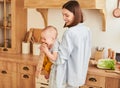 A mother and a baby boy are having fun in the kitchen Royalty Free Stock Photo