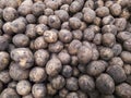 Young potatoes slide, texture. Potatoes on the shelf of the supermarket and market. Vegetables. Cooking. Royalty Free Stock Photo