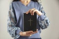 Young prayer woman holding Bible