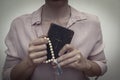 Young praying christian woman`s hands with a rosary and holy bible Royalty Free Stock Photo