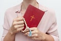 Young praying christian woman`s hands with a rosary and holy bible Royalty Free Stock Photo