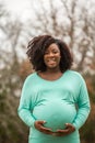 Happy African American Pregnant Woman Smiling Outside