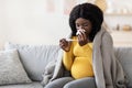 Young pregnant african woman feeling sick with high fever Royalty Free Stock Photo