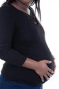 Young pregnant black African woman touching her belly isolated on white background Royalty Free Stock Photo