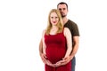 Young pregnant couple in love expecting child, studioportrait Royalty Free Stock Photo