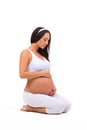 Young pregnant girl sitting quietly. Healthy and Beautiful Pregnancy Royalty Free Stock Photo