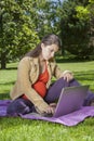 Young pregnant with laptop Royalty Free Stock Photo