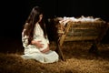 Young Pregnant Mary with Manger Royalty Free Stock Photo