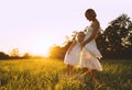 Young pregnant mother and daughter on nature outdoors Royalty Free Stock Photo