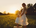 Young pregnant mother and daughter on nature outdoors Royalty Free Stock Photo
