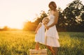 Young pregnant mother and daughter on nature outdoors Royalty Free Stock Photo