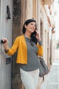 Pregnant woman using cellphone on the street Royalty Free Stock Photo