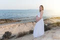 Silhouette of a pregnant woman on the beach at sunset Royalty Free Stock Photo