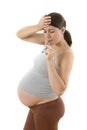 Pregnant Woman using Digital Thermometer Royalty Free Stock Photo