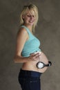Young pregnant woman dancing to music with her unborn child Royalty Free Stock Photo