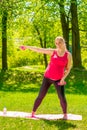 Young pregnant woman doing exercises with dumbbells Royalty Free Stock Photo