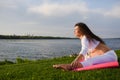 Young pregnant woman doing yoga outdoors Royalty Free Stock Photo