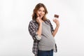 young pregnant woman eating chocolate and smiling at camera Royalty Free Stock Photo