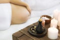 Young pregnant woman have massage treatment at spa