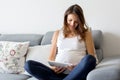 Young pregnant woman, having painful contraction, starting labor Royalty Free Stock Photo