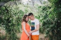 Young pregnant woman with her husband holding hands on her belly Royalty Free Stock Photo