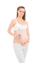 A young pregnant woman holding a bottle of fresh water Royalty Free Stock Photo