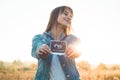 Young Pregnant Woman holding ultrasound photo at Sunset and Embracing her Belly. 4 Month Pregnancy. Maternity Concept. Toned Photo Royalty Free Stock Photo