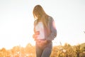 Young Pregnant Woman holding ultrasound photo at Sunset and Embracing her Belly. 4 Month Pregnancy. Maternity Concept. Toned Photo Royalty Free Stock Photo