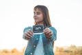 Young Pregnant Woman holding ultrasound photo at Sunset and Embracing her Belly. 4 Month Pregnancy. Maternity Concept. Toned Photo Royalty Free Stock Photo