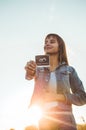 Young Pregnant Woman holding ultrasound photo at Sunset and Embracing her Belly. 4 Month Pregnancy. Maternity Concept. Toned Photo Royalty Free Stock Photo