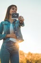 Young Pregnant Woman holding ultrasound photo at Sunset and Embracing her Belly. 4 Month Pregnancy. Maternity Concept. Toned Photo Royalty Free Stock Photo