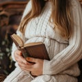 Young pregnant woman holding a bible in her hands