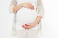 Young pregnant woman holds her hands on her swollen belly. Love concept. Happy event,birth of a child Royalty Free Stock Photo