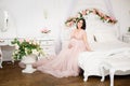 Young pregnant woman in a light classic interior. Royalty Free Stock Photo