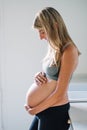 Pregnant woman looking at her belly Royalty Free Stock Photo